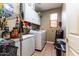 Convenient laundry room with washer, dryer, and ample storage at 16806 W Halifax St, Surprise, AZ 85374