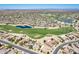 Aerial view of a community with golf course and lake at 16806 W Halifax St, Surprise, AZ 85374