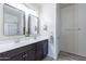 Modern bathroom with double vanity and large mirrors at 3816 N 298Th Ln, Buckeye, AZ 85396