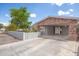 Brick home with carport and landscaped yard at 515 W Romley Ave, Phoenix, AZ 85041