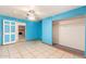 Bedroom with blue walls, tile floor and closet at 515 W Romley Ave, Phoenix, AZ 85041