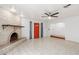 Living room with fireplace and red front door at 515 W Romley Ave, Phoenix, AZ 85041