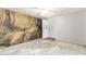 Bedroom with nature mural and ceiling fan at 515 W Romley Ave, Phoenix, AZ 85041