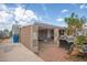 Partially covered patio with brick and gravel flooring at 515 W Romley Ave, Phoenix, AZ 85041