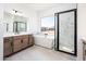 Bathroom with walk-in shower, soaking tub, and modern vanity at 115 E Santa Cruz Dr, Phoenix, AZ 85085