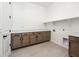 Laundry room with wooden cabinets and countertop at 115 E Santa Cruz Dr, Phoenix, AZ 85085