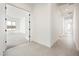 Bright hallway with tile floors and access to bedroom and other rooms at 115 E Santa Cruz Dr, Phoenix, AZ 85085