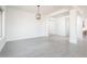 Bright dining room with tile floors and modern light fixture at 115 E Santa Cruz Dr, Phoenix, AZ 85085