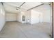 Bright garage with utility sink and storage at 115 E Santa Cruz Dr, Phoenix, AZ 85085