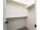Large walk-in closet with built-in shelves and rods at 115 E Santa Cruz Dr, Phoenix, AZ 85085