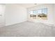 Large bedroom with carpet flooring and expansive window views at 115 E Santa Cruz Dr, Phoenix, AZ 85085