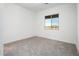 Bright bedroom with carpet flooring and window at 115 E Santa Cruz Dr, Phoenix, AZ 85085