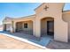 Front view of a new construction home with a two-car garage and desert landscaping at 115 E Santa Cruz Dr, Phoenix, AZ 85085