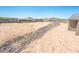 Landscaped backyard with rock retaining wall at 115 E Santa Cruz Dr, Phoenix, AZ 85085