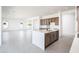 Modern kitchen with island, stainless steel appliances, and light wood cabinets at 115 E Santa Cruz Dr, Phoenix, AZ 85085