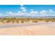 Aerial view of a vacant lot with desert landscape and mountain views at 115 E Santa Cruz Dr, Phoenix, AZ 85085