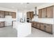 Modern kitchen with white cabinets and a large island at 115 E Santa Cruz Dr, Phoenix, AZ 85085