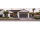 Front view of a modern farmhouse with dark gray garage doors at 6836 N 13Th Pl # A, Phoenix, AZ 85014