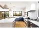 Open kitchen with marble island and stainless steel appliances at 6836 N 13Th Pl # B, Phoenix, AZ 85014