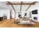 Spacious living room with high ceilings, exposed beams, and fireplace at 6836 N 13Th Pl # B, Phoenix, AZ 85014