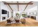 Open concept living room with exposed wood beams and fireplace at 6836 N 13Th Pl # B, Phoenix, AZ 85014