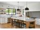Modern kitchen with marble countertops, stainless steel appliances, and an island at 6836 N 13Th Pl # B, Phoenix, AZ 85014