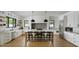 Modern kitchen with white cabinets, marble counters, and an island at 6836 N 13Th Pl # B, Phoenix, AZ 85014