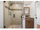 Bathroom with walk-in shower, granite countertop, and wood vanity at 7211 E Sunnyside Dr, Scottsdale, AZ 85260