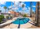 Stunning kidney-shaped pool with diving board, plenty of lounge space, and palm trees at 7211 E Sunnyside Dr, Scottsdale, AZ 85260