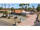 Single story home with a large driveway, landscaping, and gated entry at 7211 E Sunnyside Dr, Scottsdale, AZ 85260