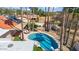 Aerial view showcasing a kidney-shaped pool, patio, and surrounding landscape at 7211 E Sunnyside Dr, Scottsdale, AZ 85260