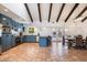 Spacious kitchen with breakfast bar, stainless steel appliances and views to the pool at 7211 E Sunnyside Dr, Scottsdale, AZ 85260