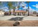 Single story home with tile roof, paver driveway and desert landscaping at 7211 E Sunnyside Dr, Scottsdale, AZ 85260