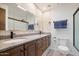 Double vanity bathroom with granite countertops and tile floors at 7211 E Sunnyside Dr, Scottsdale, AZ 85260