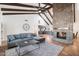 Spacious living room with a stone fireplace and high ceilings at 7211 E Sunnyside Dr, Scottsdale, AZ 85260