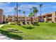 Landscaped lawn area showcasing manicured grass and surrounding buildings at 930 N Mesa Dr # 2037, Mesa, AZ 85201