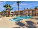Relaxing kidney-shaped pool and spa with surrounding patio and landscaping at 930 N Mesa Dr # 2037, Mesa, AZ 85201