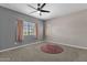 Bedroom with ceiling fan and two windows at 930 N Mesa Dr # 2037, Mesa, AZ 85201
