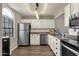 Bright kitchen with stainless steel appliances and white cabinets at 930 N Mesa Dr # 2037, Mesa, AZ 85201