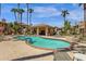 Community pool and spa with plenty of lounge chairs for sunbathing at 930 N Mesa Dr # 2037, Mesa, AZ 85201
