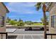 View from balcony showing parking area, playground, and open green space at 930 N Mesa Dr # 2037, Mesa, AZ 85201