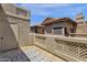 Private balcony with tiled flooring and wrought iron railings, overlooking neighboring buildings at 930 N Mesa Dr # 2037, Mesa, AZ 85201
