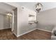 Open dining area with chandelier and hardwood floors at 930 N Mesa Dr # 2037, Mesa, AZ 85201