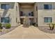 Building exterior with stairs leading to individual condo entrances at 930 N Mesa Dr # 2037, Mesa, AZ 85201