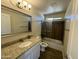 Bathroom boasts granite vanity, updated fixtures and a shower/tub combo at 13419 S Hermit Rd, Buckeye, AZ 85326