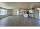 Open concept kitchen features granite countertops and stainless steel appliances at 13419 S Hermit Rd, Buckeye, AZ 85326