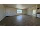 Open living area with tile floors and access to other rooms at 13419 S Hermit Rd, Buckeye, AZ 85326