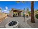 Outdoor patio area with fire pit and seating, adjacent to the house at 6202 E Mckellips Rd # 310, Mesa, AZ 85215