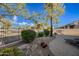Landscaped backyard with a brick patio and plenty of greenery at 6202 E Mckellips Rd # 310, Mesa, AZ 85215