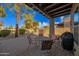 Relaxing backyard patio with seating area, fire pit and grill at 6202 E Mckellips Rd # 310, Mesa, AZ 85215